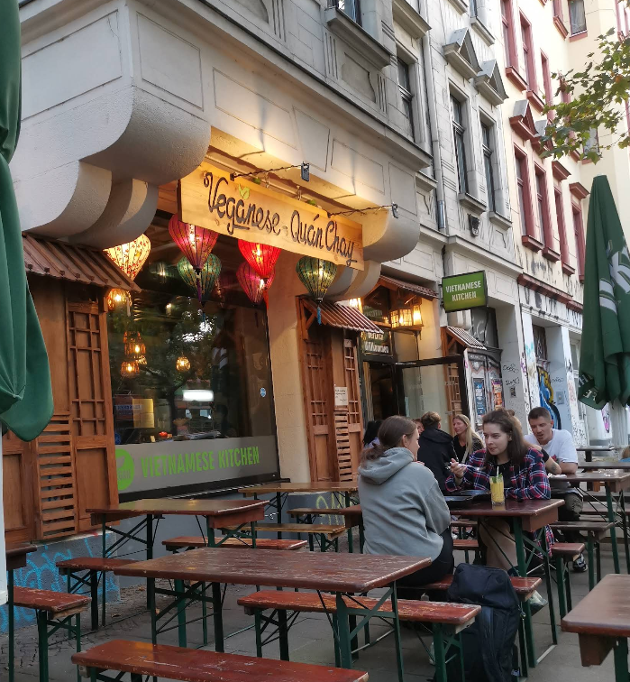 Veganese's outdoor terrace with beer-garden tables on Karl-Heine-Straße