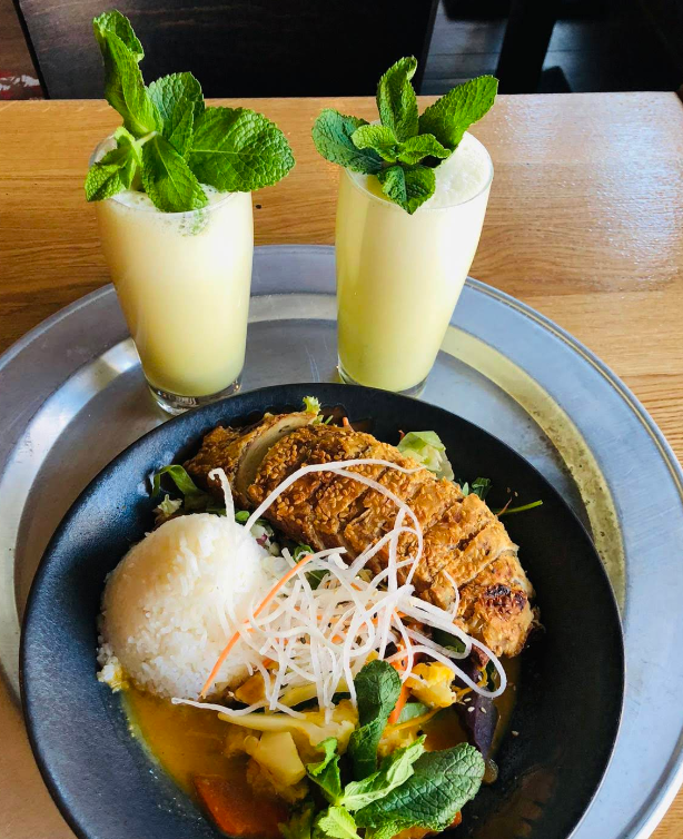 Vegan duck — sesame-crusted seitan over salad and rice, with two house lassis